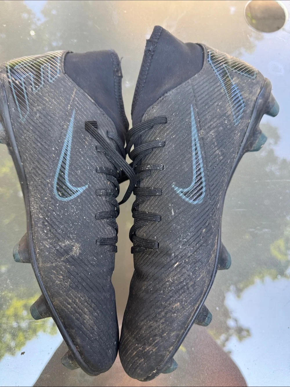 Nike Men’s Black Soccer Cleats with Subtle Blue Swoosh